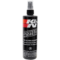 K&N filterrens sprayflaske til effektiv rengøring af luftfiltre, med tydelig branding og sikkerhedsinformation på sort baggrund.